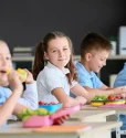 depositphotos_443785544-stock-photo-pupils-having-healthy-lunch-classroom